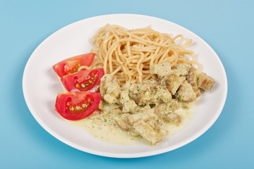 Spaghetti with tempeh and herb sauce on a table