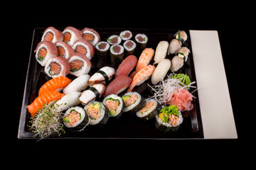 Sushi set isolated on the black background.