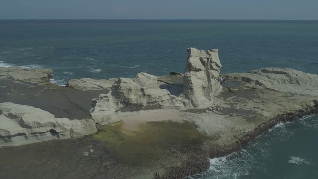 Cinematic aerial footage of rock tower beach, Klayar, Pacitan, East Java, Indonesia. RAW, unedited and ungraded format.