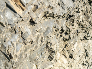 Basalt rock mountain near black sand beach in Iceland