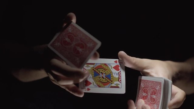 Close-up of a Magician's Hands Performing Card Trick. Manipulations with cards. 4k