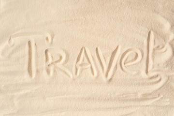 Fototapeta na wymiar Travel inscription on summer sandy beach
