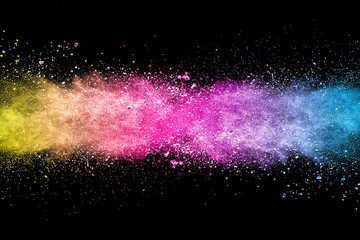 Explosion of multicolored dust on black background. - 204250629