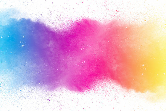 Explosion of multicolored dust on white background. © Chaiwat