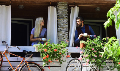 Fototapeta na wymiar Couple in love holds cups of coffee outside.