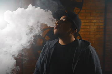 Man in a cloud of white vapour fume