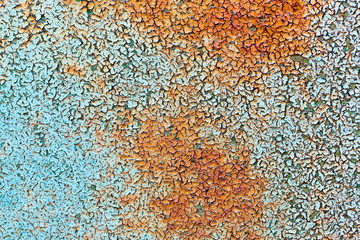 background fo rusty painted iron. texture of old rusty sheet of iron with crumbling paint. rusty metal sheet in paint