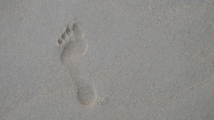 Footprint on the sand texture.