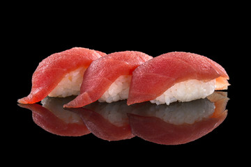 nigiri with tuna - sushi set on the black background