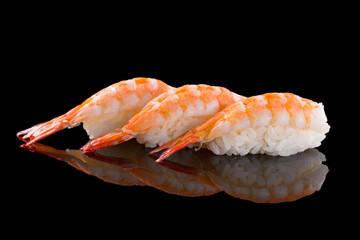 nigiri with shrimp - sushi set on the black background