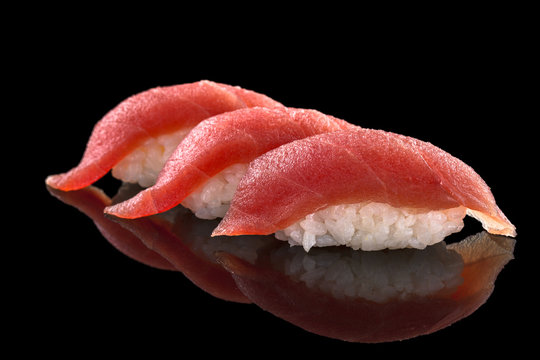 nigiri with tuna - sushi set on the black background