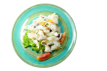 Thai spicy squid salad and fresh vegetable on plate