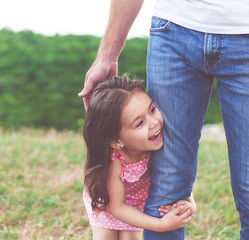 Little girl hugging father