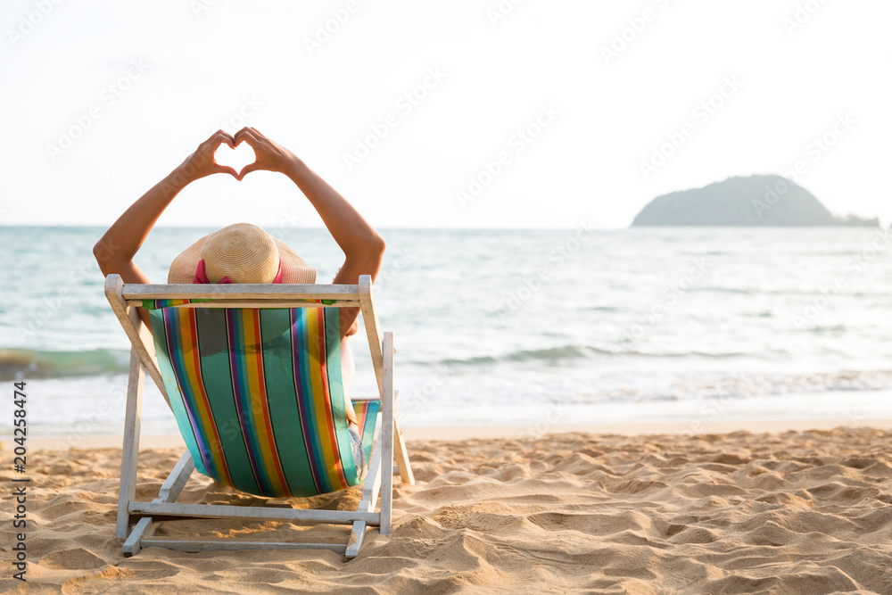 Wall mural woman on beach in summer