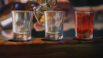 Shot glasses with liquor in the bar. - Powered by Adobe