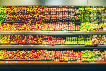 LVIV, UKRAINE– APRIL 14 2018: different kind of apples on store counter