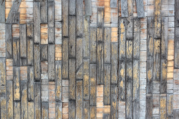 texture of old wooden parquet with the remains of yellow paint