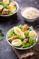 Caesar salad with eggs, chicken and parmesan