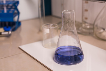 Laboratory flask with blue liquid