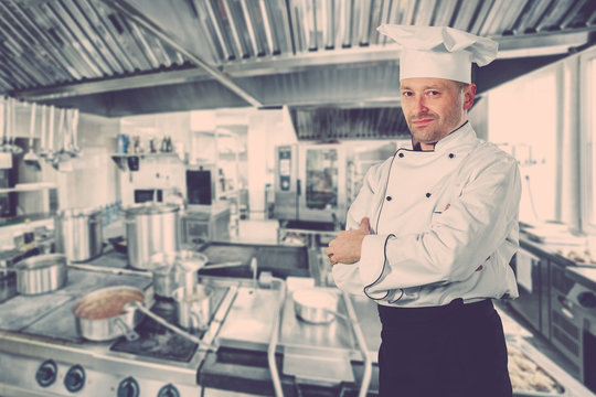serious chef standing with his arms crossed
