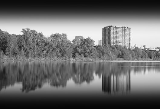 Black and white building on river backdrop