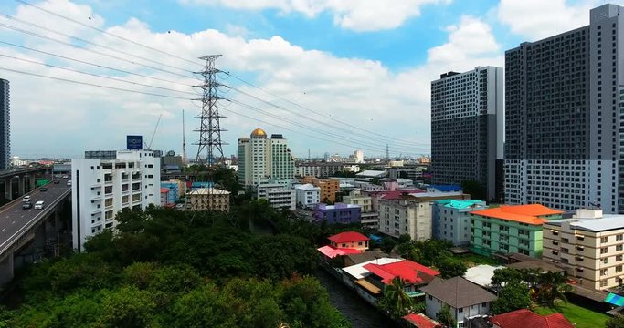Bangkok City Ascending Drone Shot Over Canal and Skyscrapers