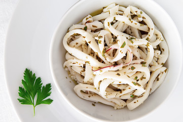 marinated in lemon juice, olive oil, garlic, and parsley boiled calamari rings  