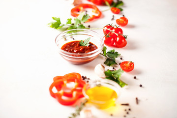 Homemade sauce adjika with pepper, garlic, tomatoes and parsley. Selective focus. Copy space