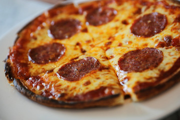 pepperoni pizza on dish , italian food