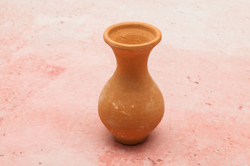 Fototapeta na wymiar Small earthenware pot - clay object