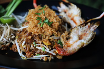 Shrimp pad thai noodles with shrimps on top , Thai food