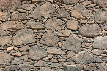 Hintergrund – Natursteinmauer mit eckigen Vulkangestein