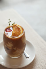 Iced Coffee latte with orange mix in close up