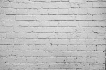 old wall from a white brick with a regular laying. horizontal direction