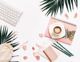 Blogger Home office workspace with keyboard, coffee, notebooks on white background. Flat lay, top...