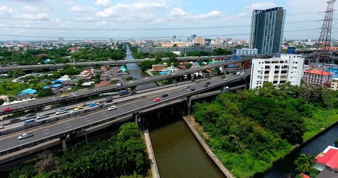 Bangkok City Ascending Drone Shot Over Canal and Skyscrapers