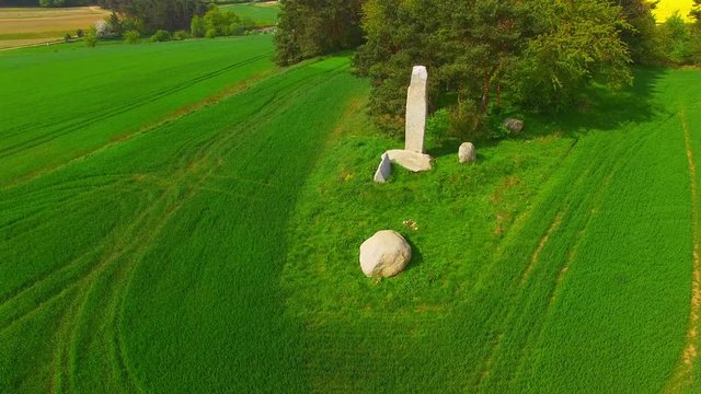 Camera flight around ancient stone monument. Menhirs and dolmens near Tesovice. Famous place for every year rituals of fertility treatment. Mysterious landmark in Czech Republic, Central Europe. 