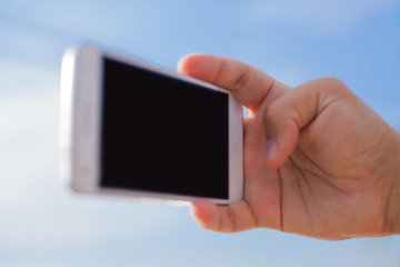 Man hand holding smartphone