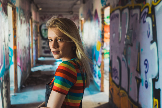 Rebel girl among bright graffiti