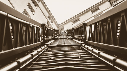 Looking up a Fireman Ladder in Sepia, Firefighter Truck extendable Ladder next to Tower Block, England 2018 shallow depth of field horizontal perspective Sepia Tone photography