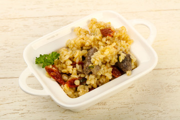 Bulgur with chicken hearts
