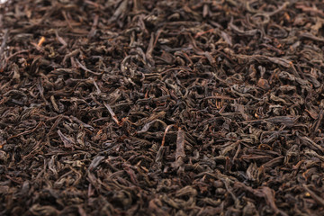 Dried tea leaves. Large leaf black tea.