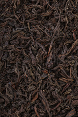 Dried tea leaves. Large leaf black tea.