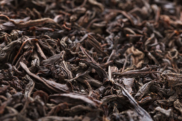 Dried tea leaves. Large leaf black tea.