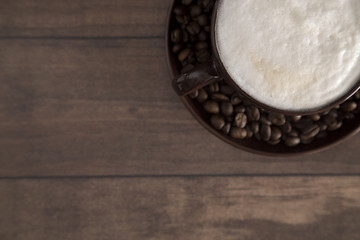 Foam Topped Coffee on a Wooden Table