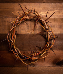 An authentic crown of thorns on a wooden background. Easter Theme