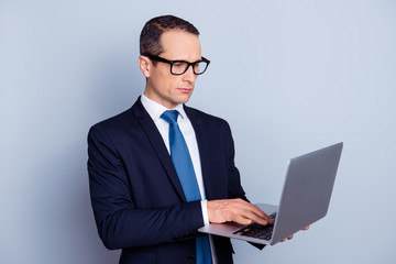 White chic classy shit groomed suit people official networking freelancer person concept. Half-turned portrait of focused smart pensive banker manager using netbook isolated on gray background