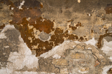 Old wall with peeling plaster background