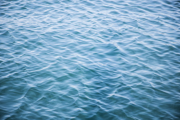 gentle ripple waves on vivid blue ocean surface background wallpaper