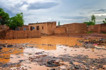 Flooded african slums with lots of garbage during the rainy season (july-august), Ouagadougou,...
